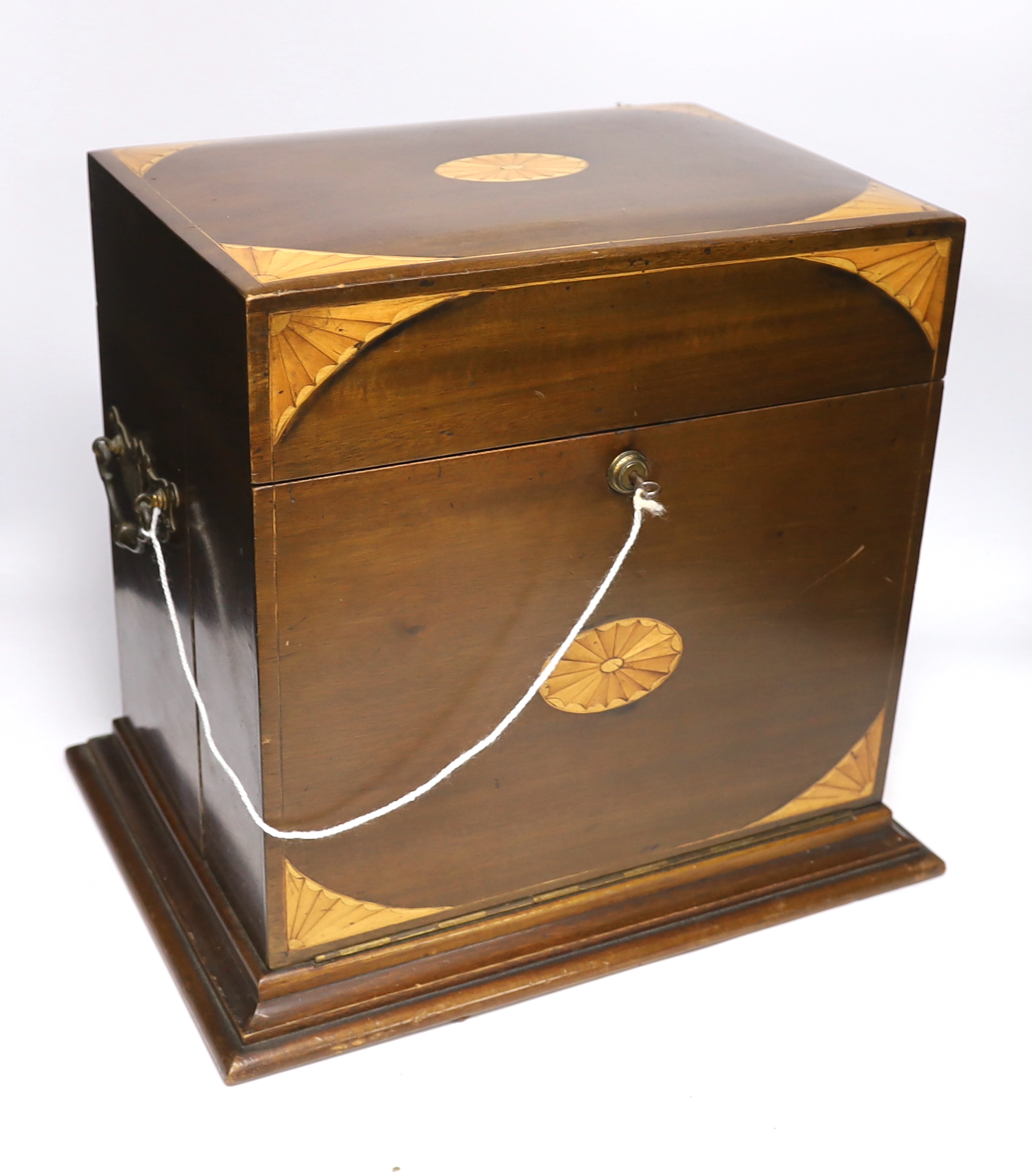 An Edwardian Sheraton revival inlaid mahogany portable drinks cabinet with tantalus and other accessories including serving trays, a brass cribbage board, with secret drawer, etc, 37cm high